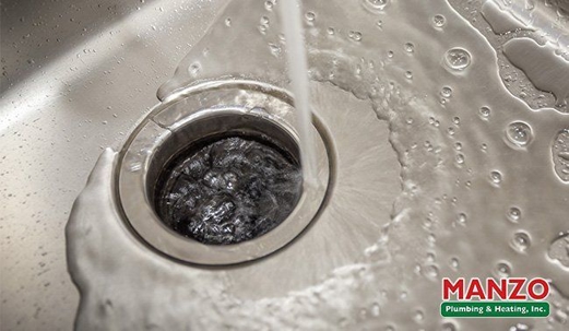 picture of water going down drain