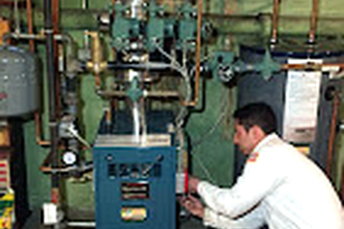 Sal Manzo technician evaluating heating equipment for furnace replacement on Long Island